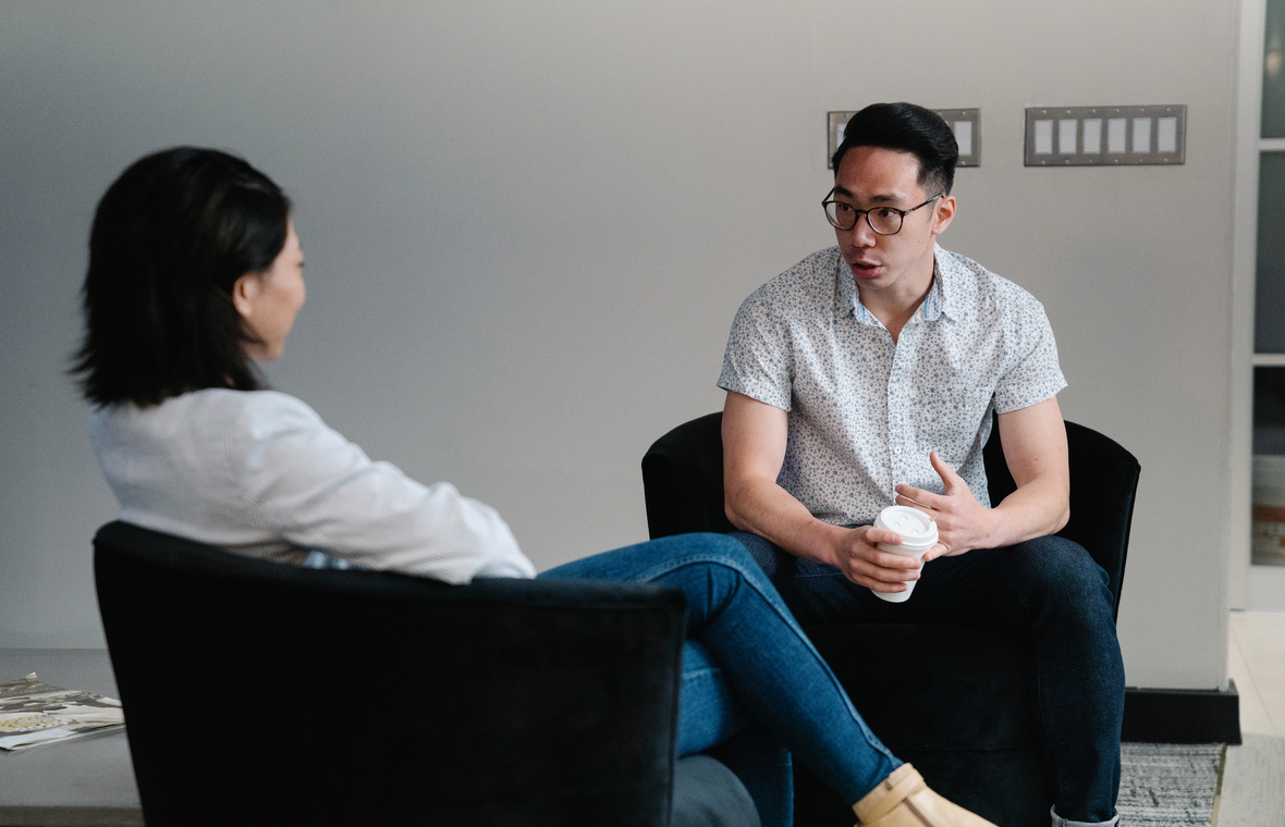 Two People Sitting and Talking